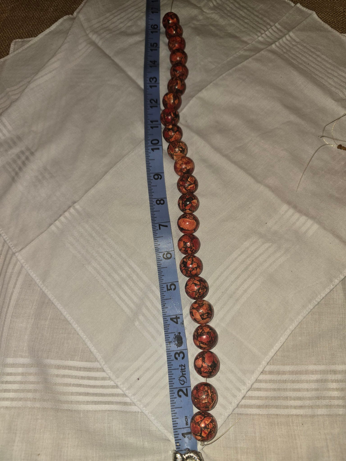 Picasso Jasper Red Creek Jasper round bead strand, red brown mosaic, 23 beads, 16 inches, with ruler for scale
