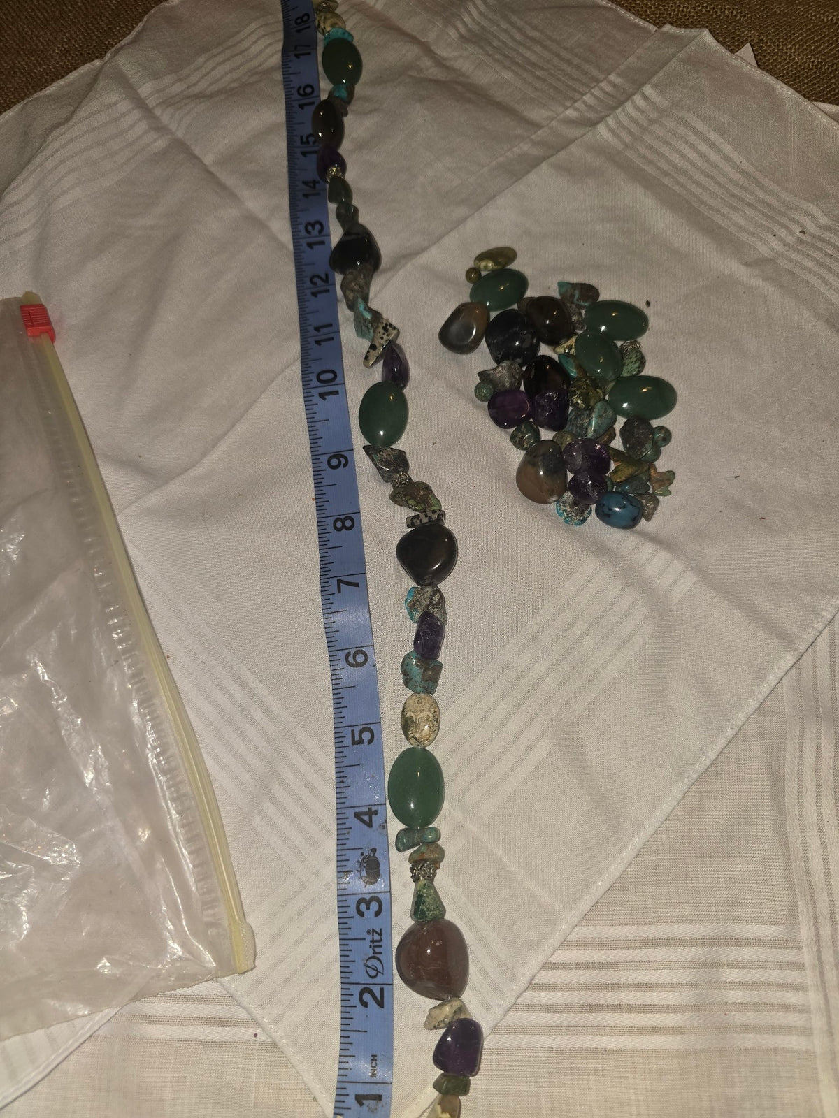 Mixed natural gemstone lot, one strand plus loose extras, green amethyst turquoise black beads, with ruler for scale