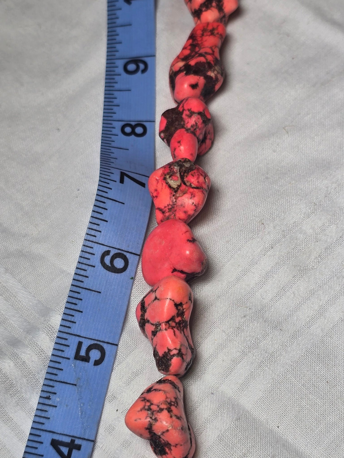 Closeup of pink magnesite nugget beads