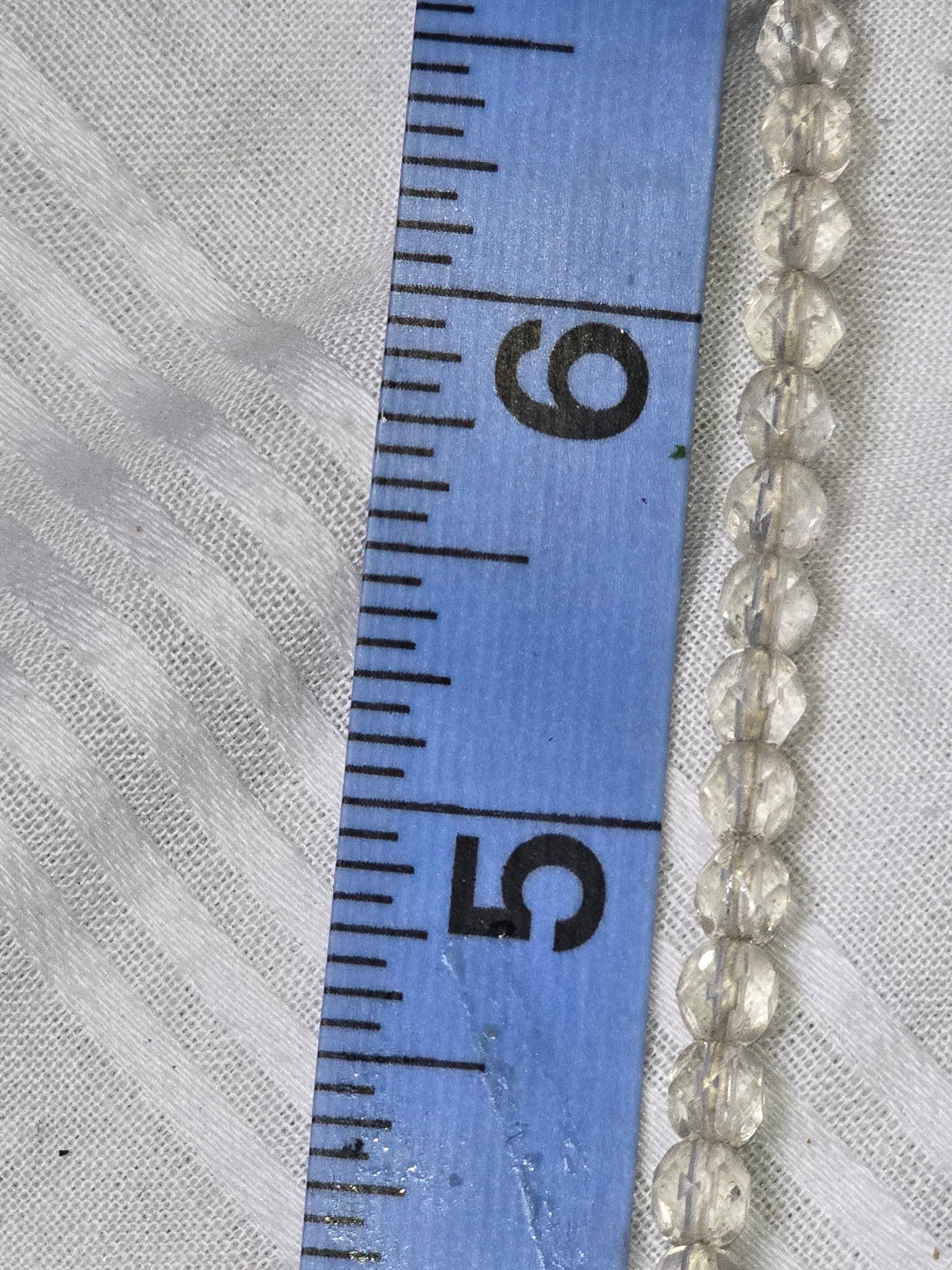 Clear quartz faceted round beads closeup