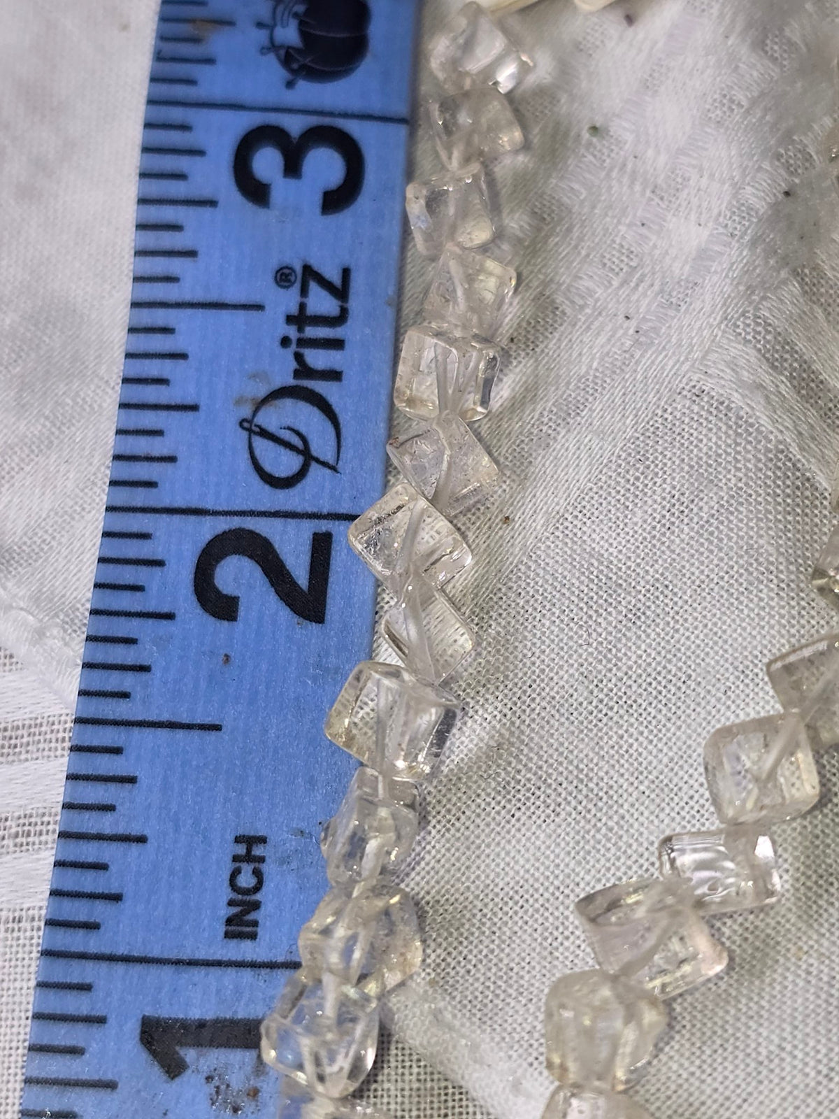 Clear quartz cube bead strand closeup