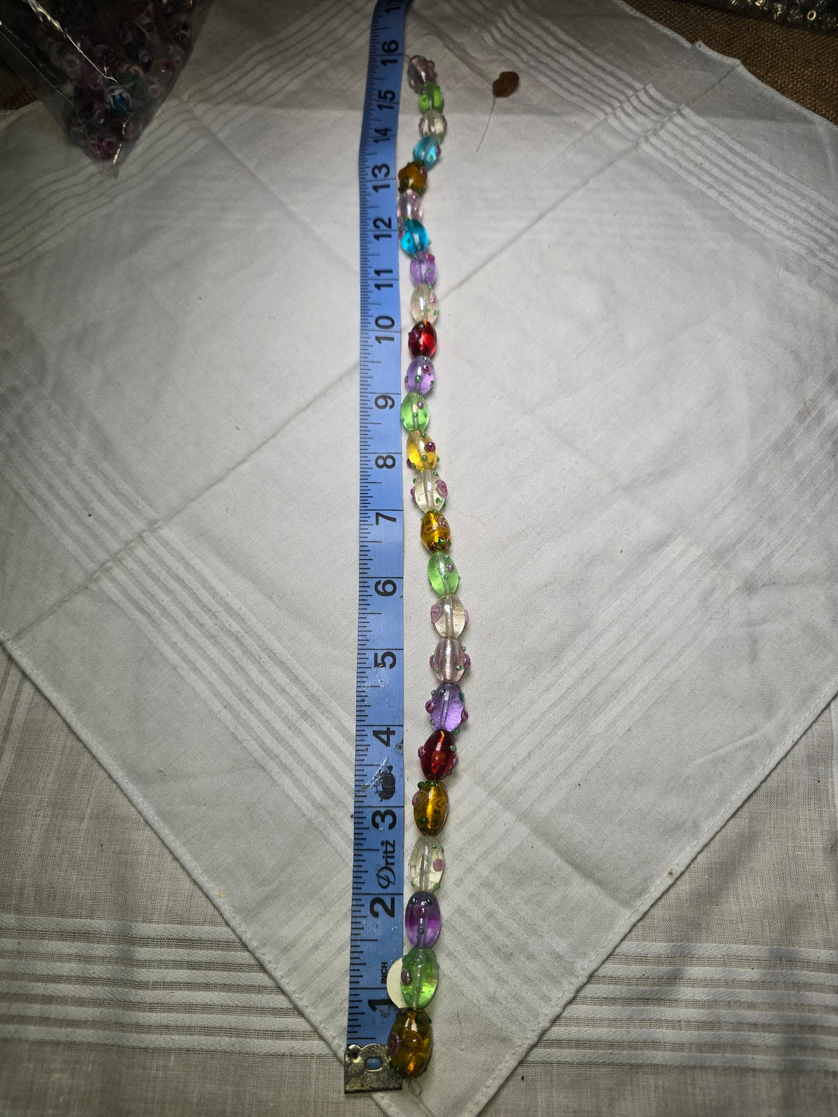 Multicolor lampwork glass oval bead strand