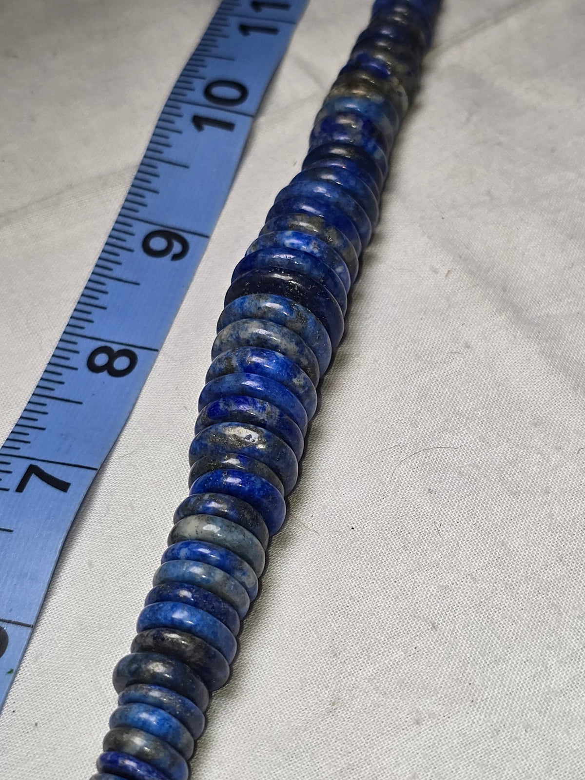 Lapis lazuli disc bead strand closeup