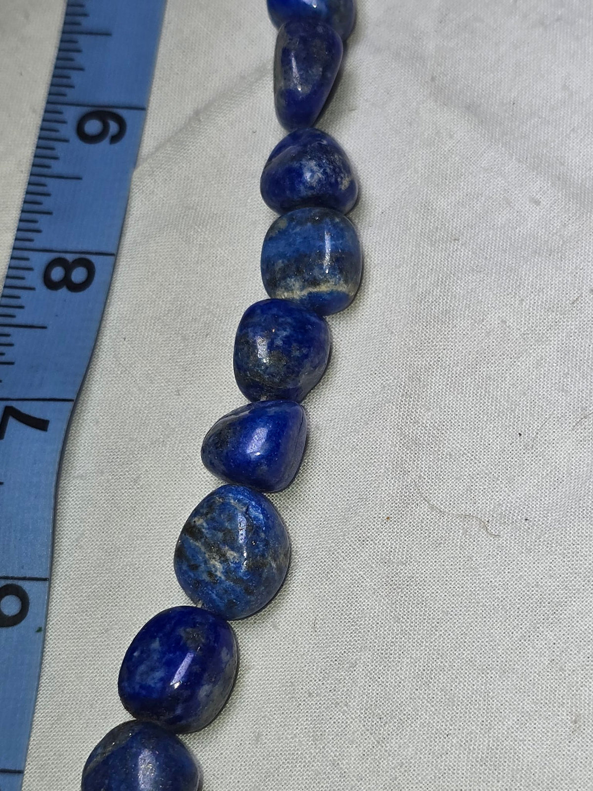 Lapis lazuli oval bead strand closeup