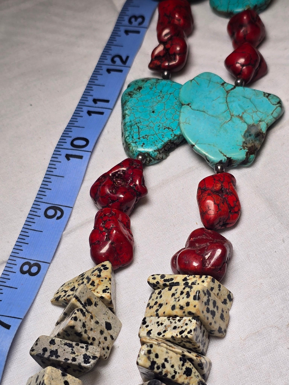 Mixed turquoise howlite dalmatian bead strand closeup
