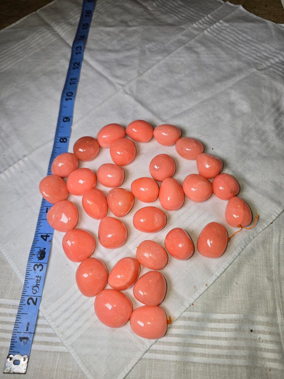 Salmon pink large oval bead strand