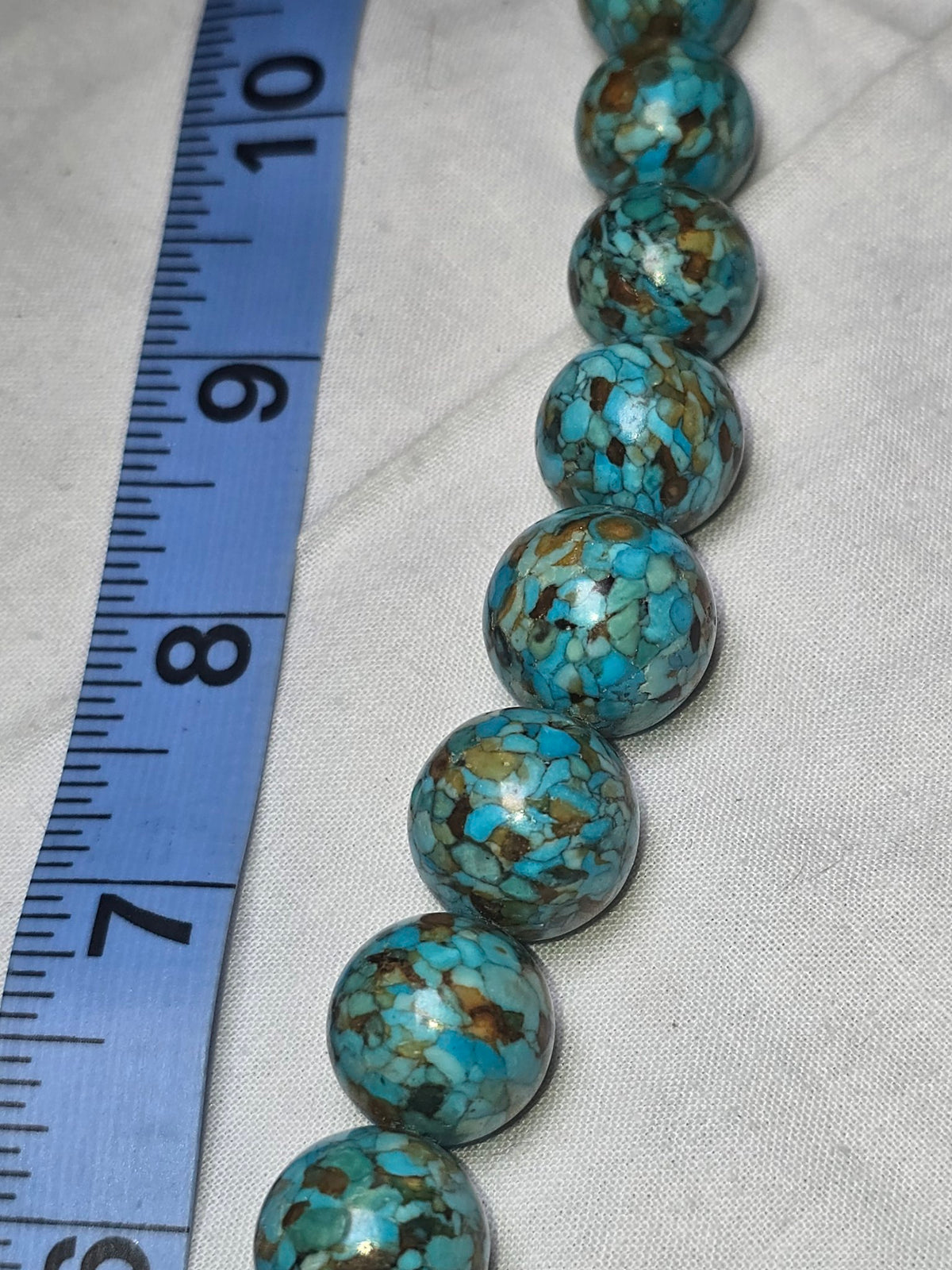 Turquoise round bead strand closeup