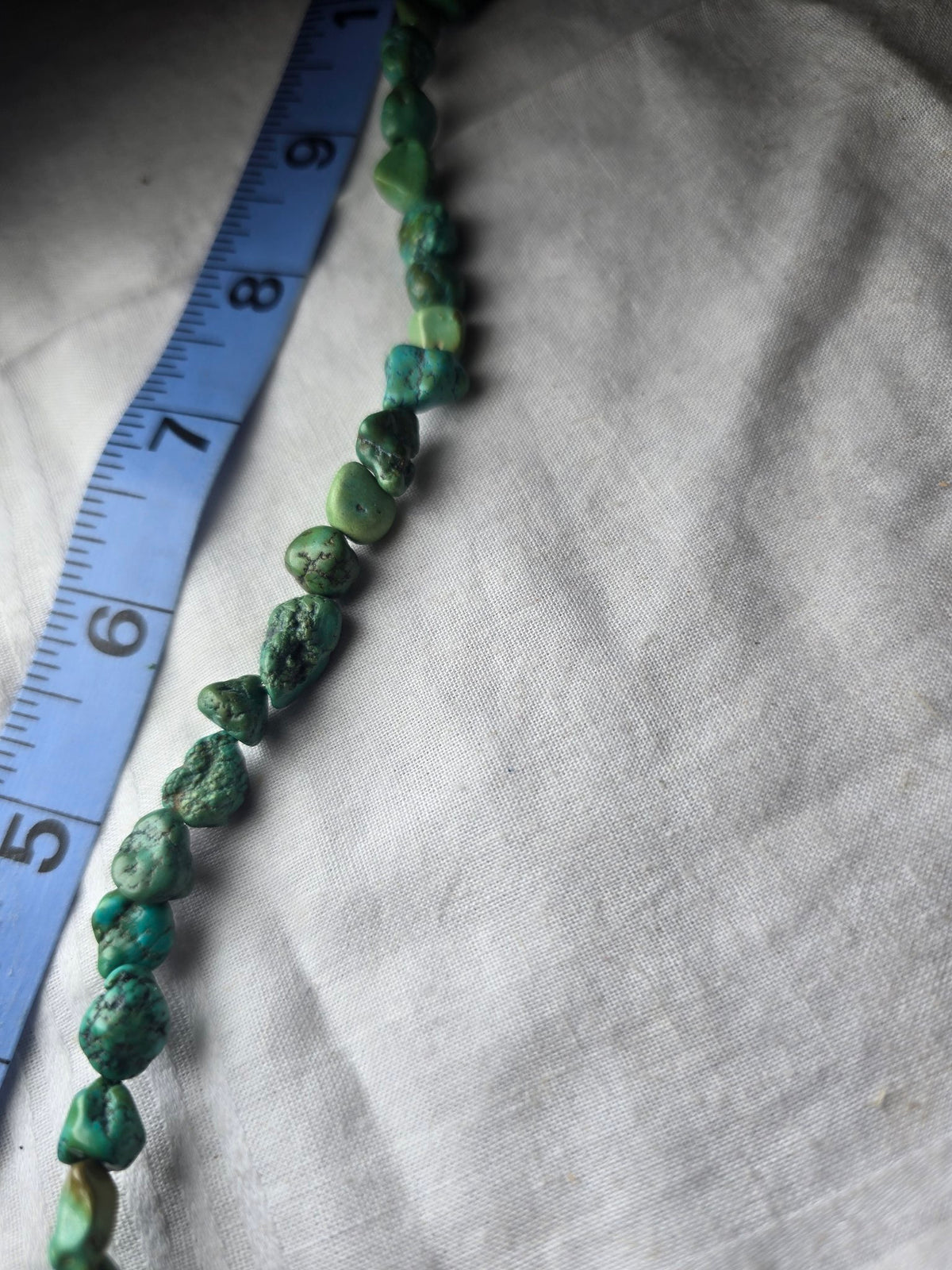 Real turquoise nugget bead strand closeup