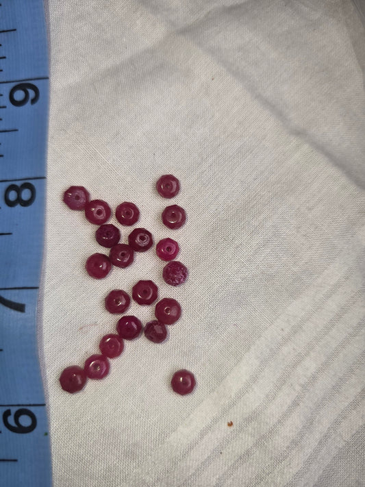 Raspberry red crystal faceted rondelle beads with ruler for scale