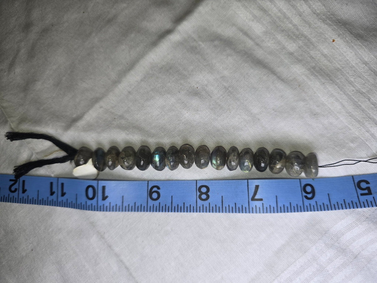 Labradorite rondelle beads with ruler for scale