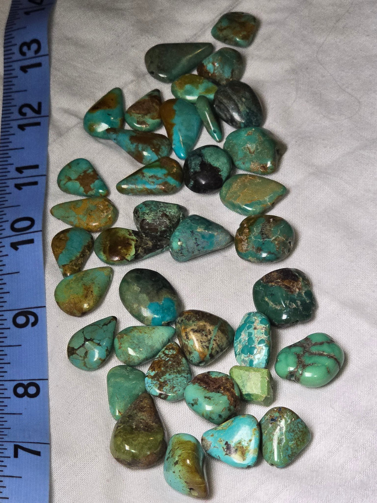 Closeup of real turquoise teardrop beads