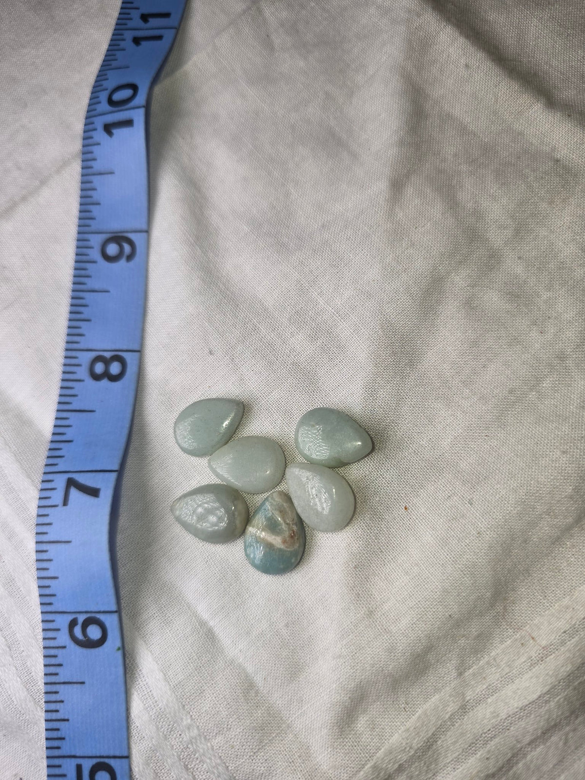 Group of 6 pale blue teardrop beads