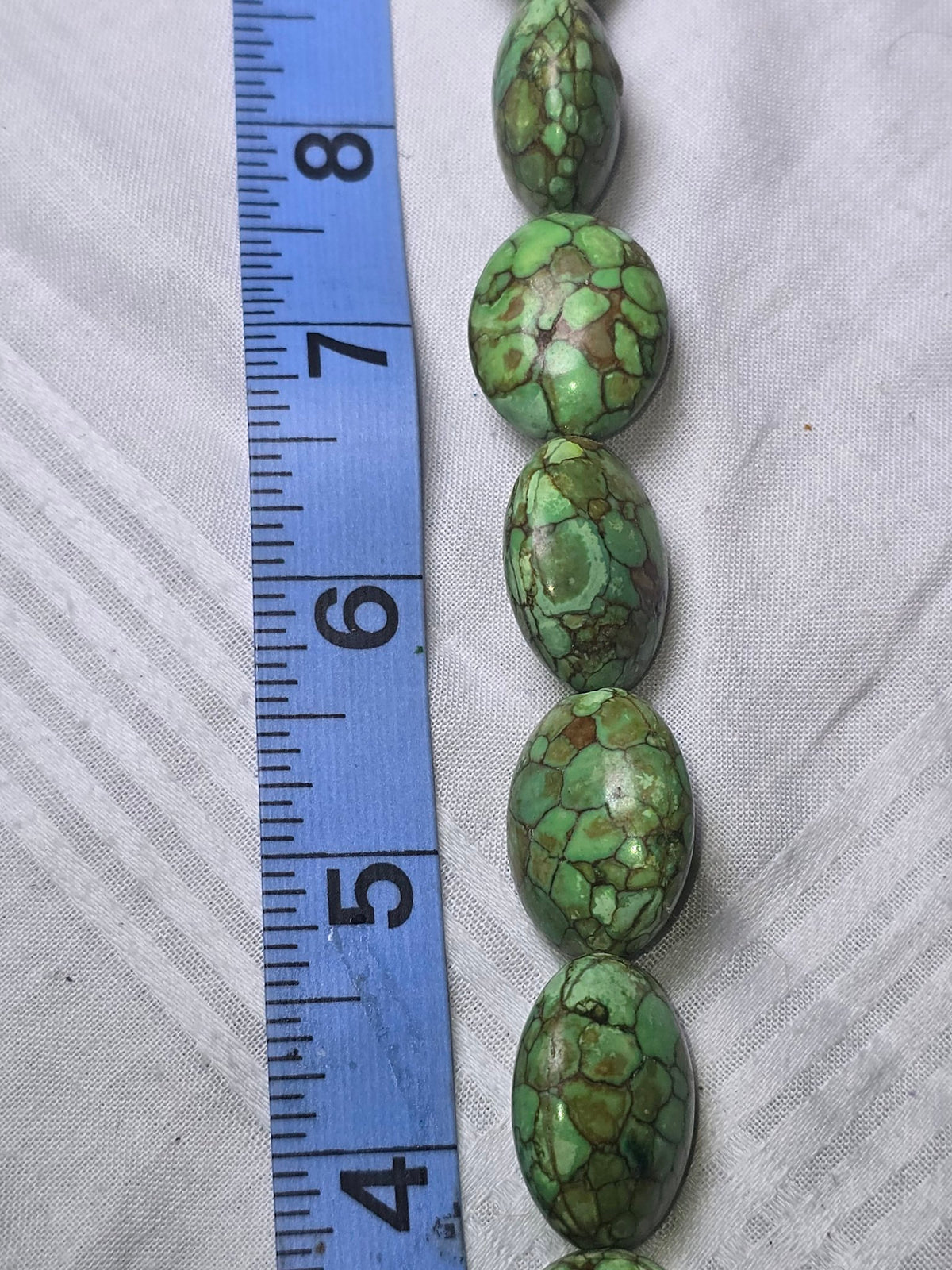 Green Picasso Jasper oval beads closeup