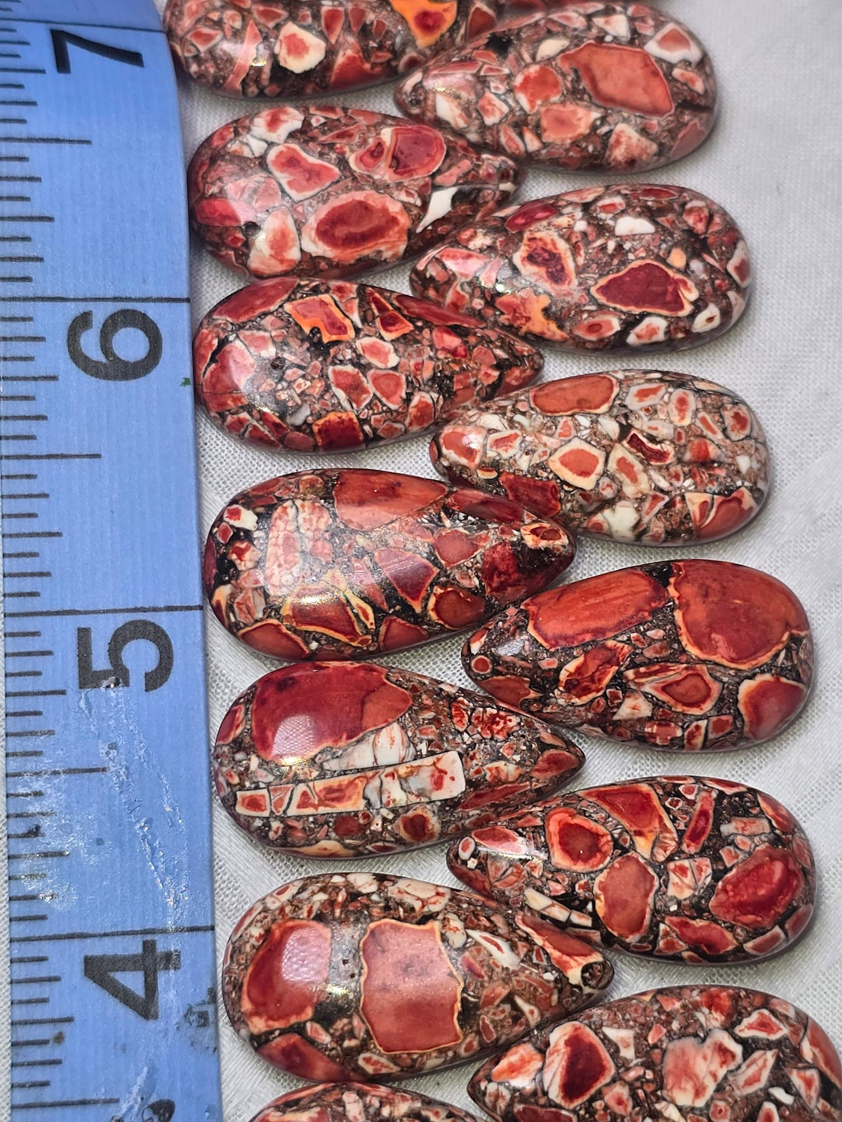 Red brecciated jasper teardrop beads closeup