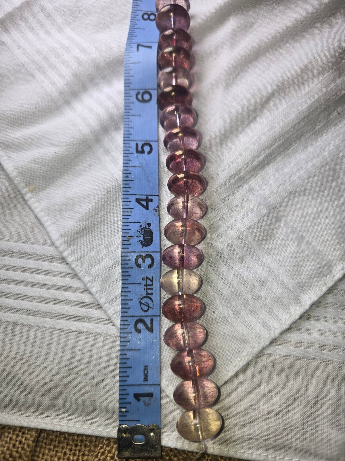 Pink purple translucent flat oval bead strand with ruler