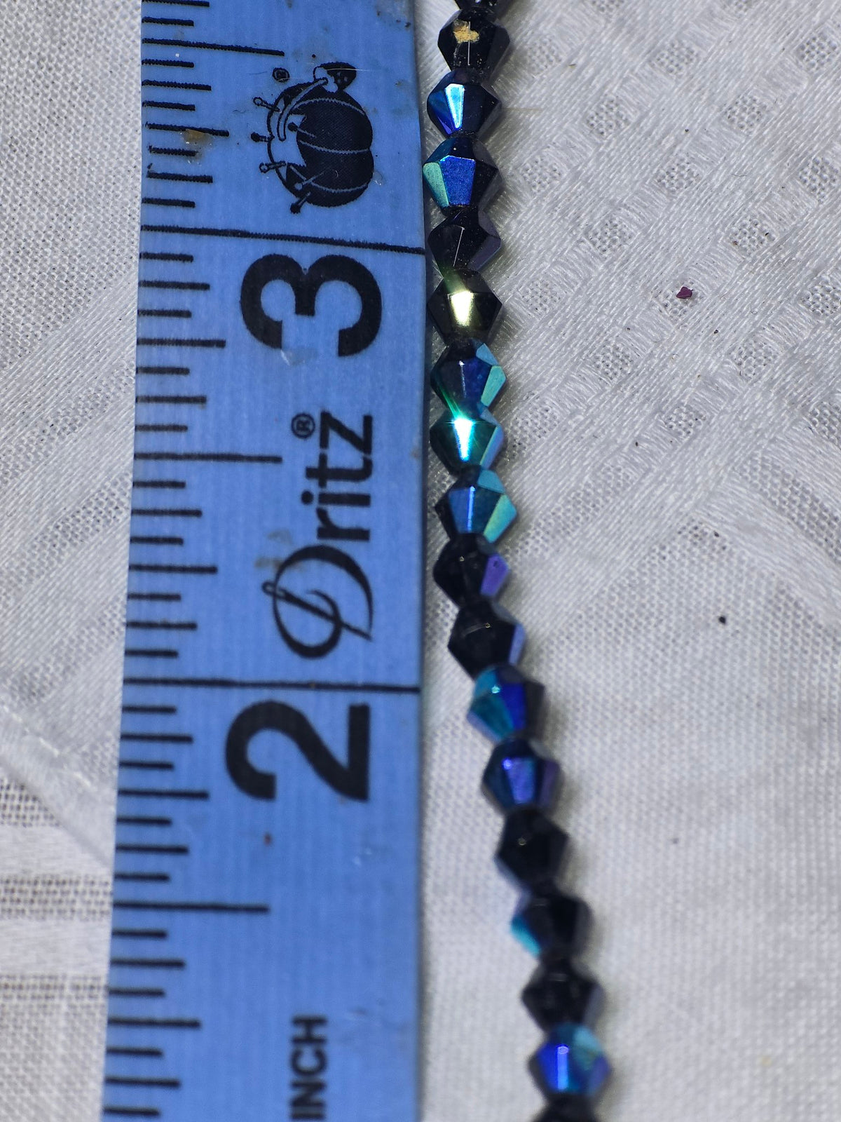 Dark blue bicone beads closeup