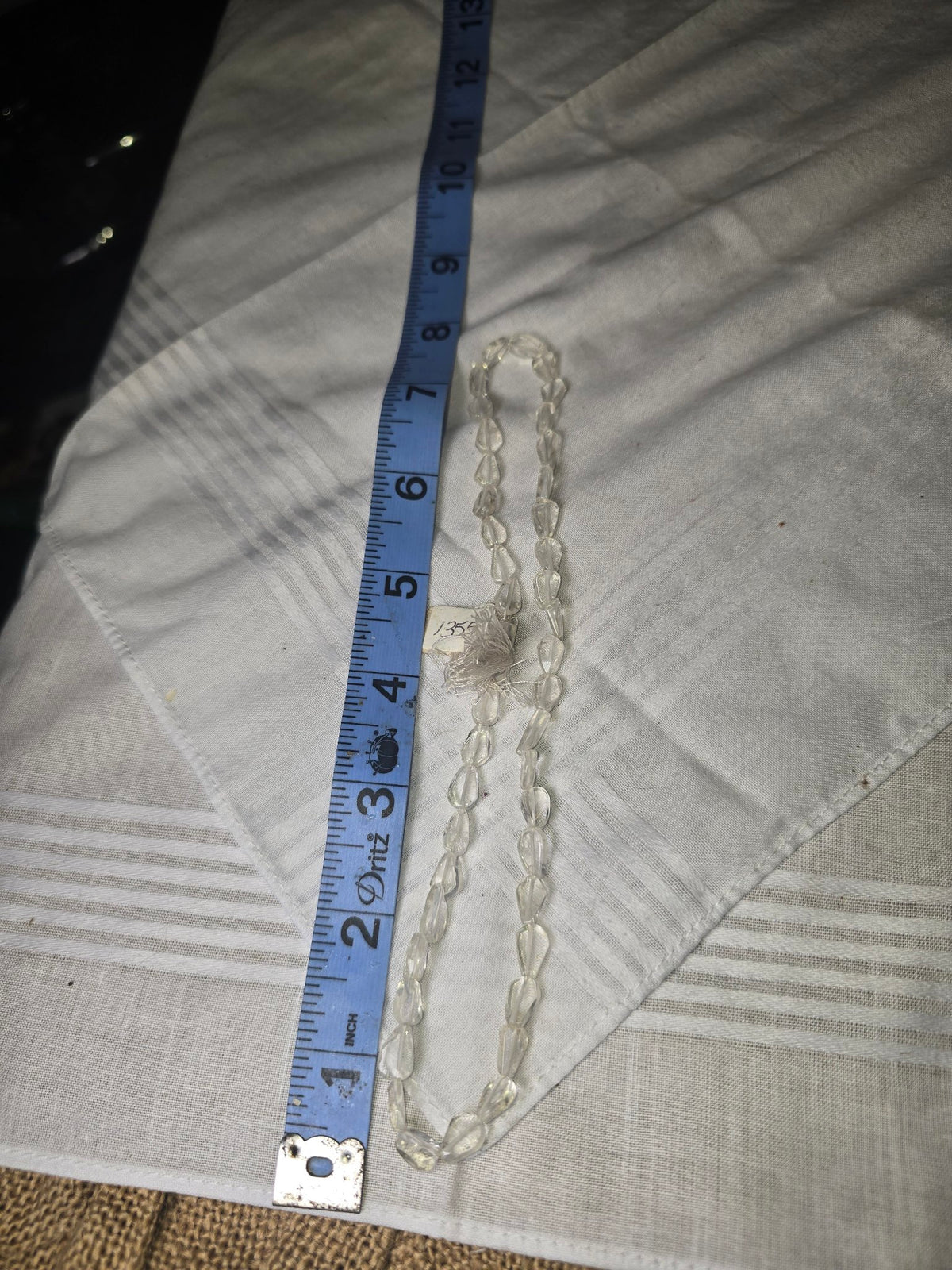 Clear quartz teardrop bead strand with ruler