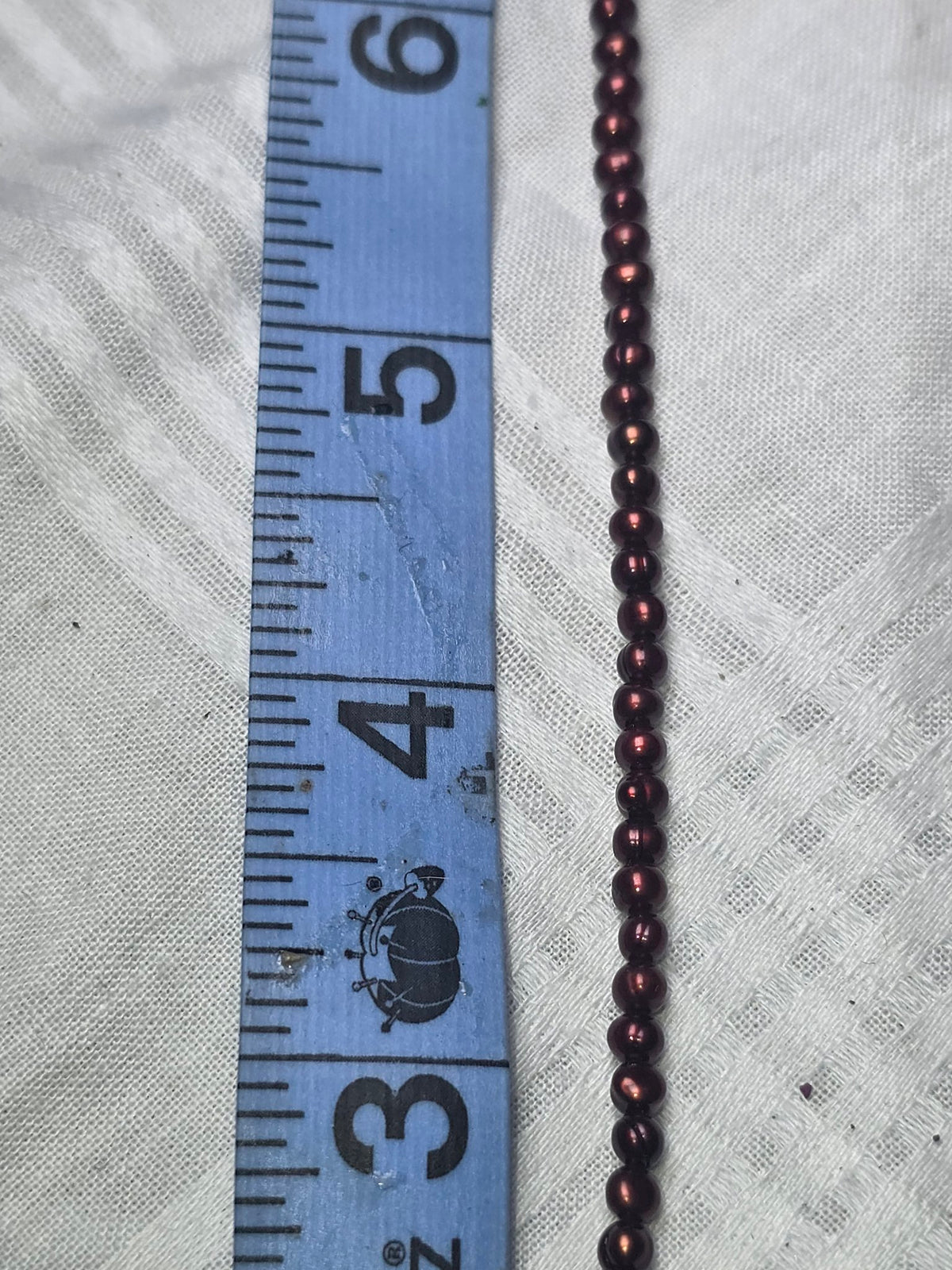 Dark burgundy freshwater pearl beads closeup