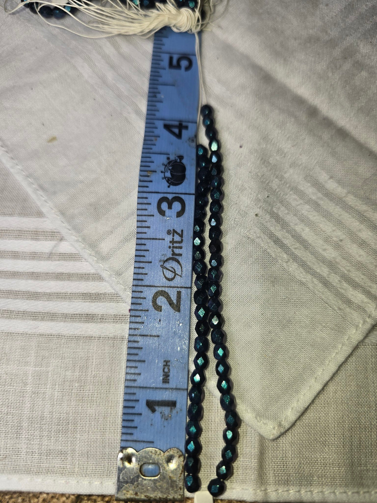 Dark blue crystal faceted round bead strand with ruler