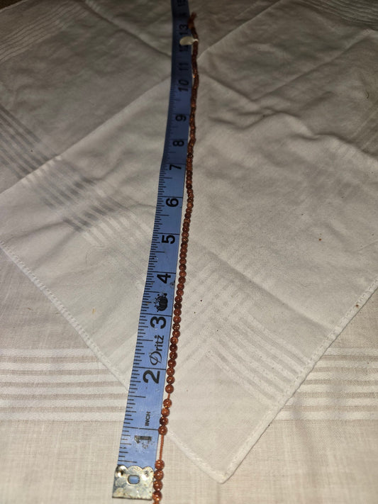 Goldstone round bead strand