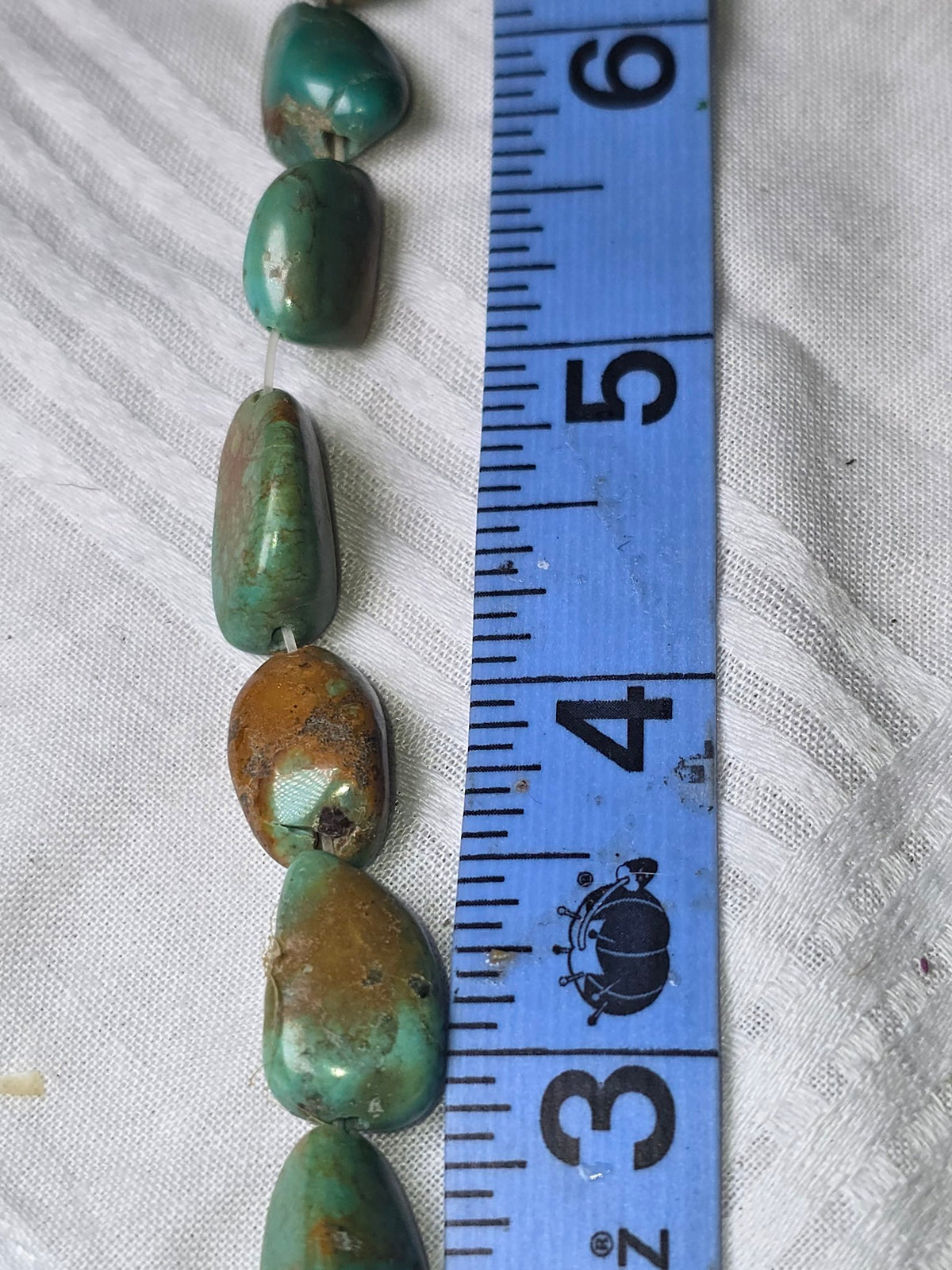 Turquoise nugget bead strand closeup
