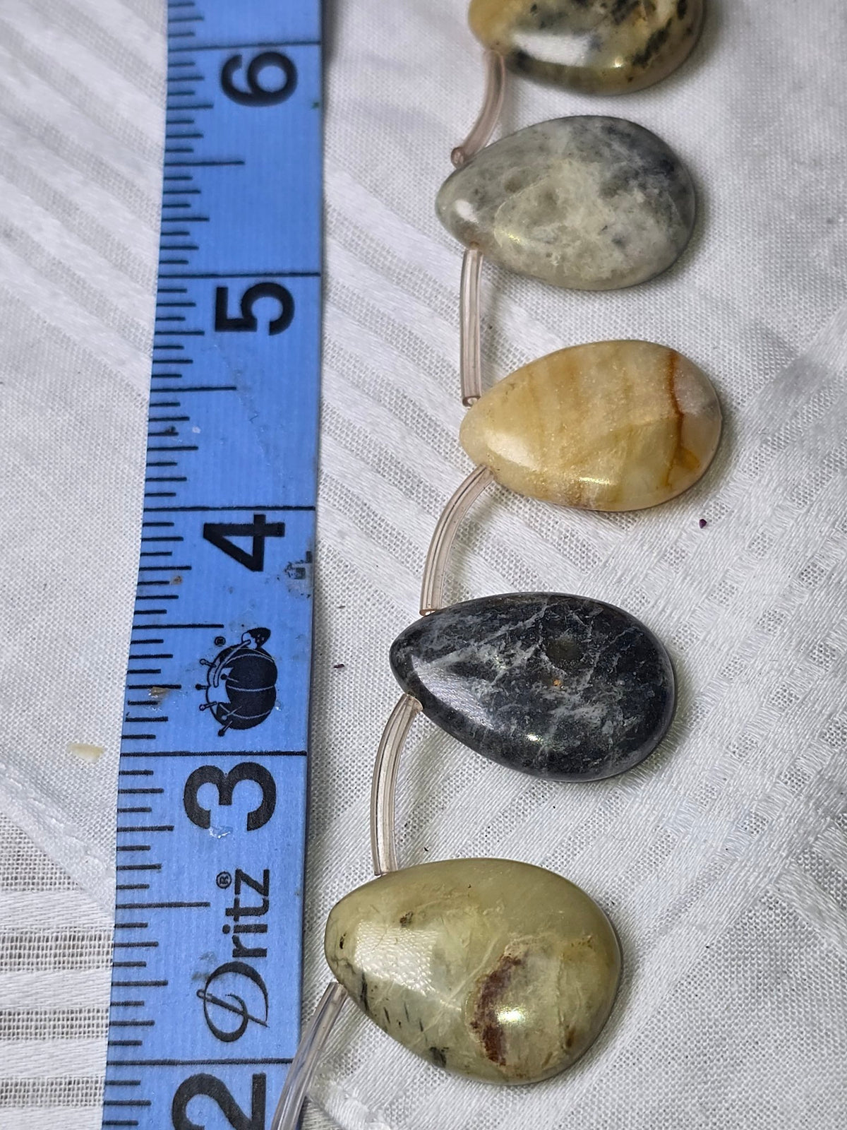 Mixed jasper teardrop bead strand closeup
