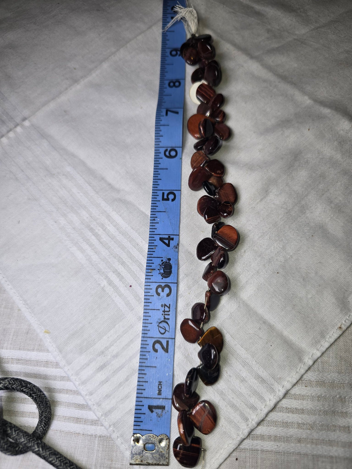 Brown tiger eye flat teardrop bead strand