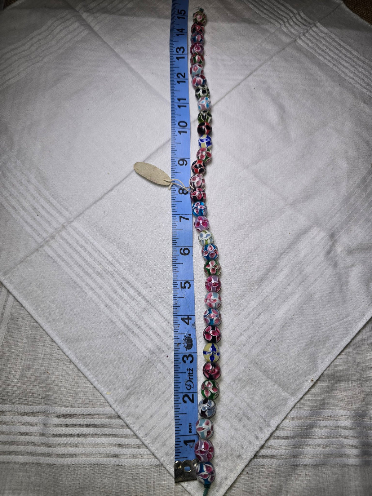 Floral lampwork glass round bead strand