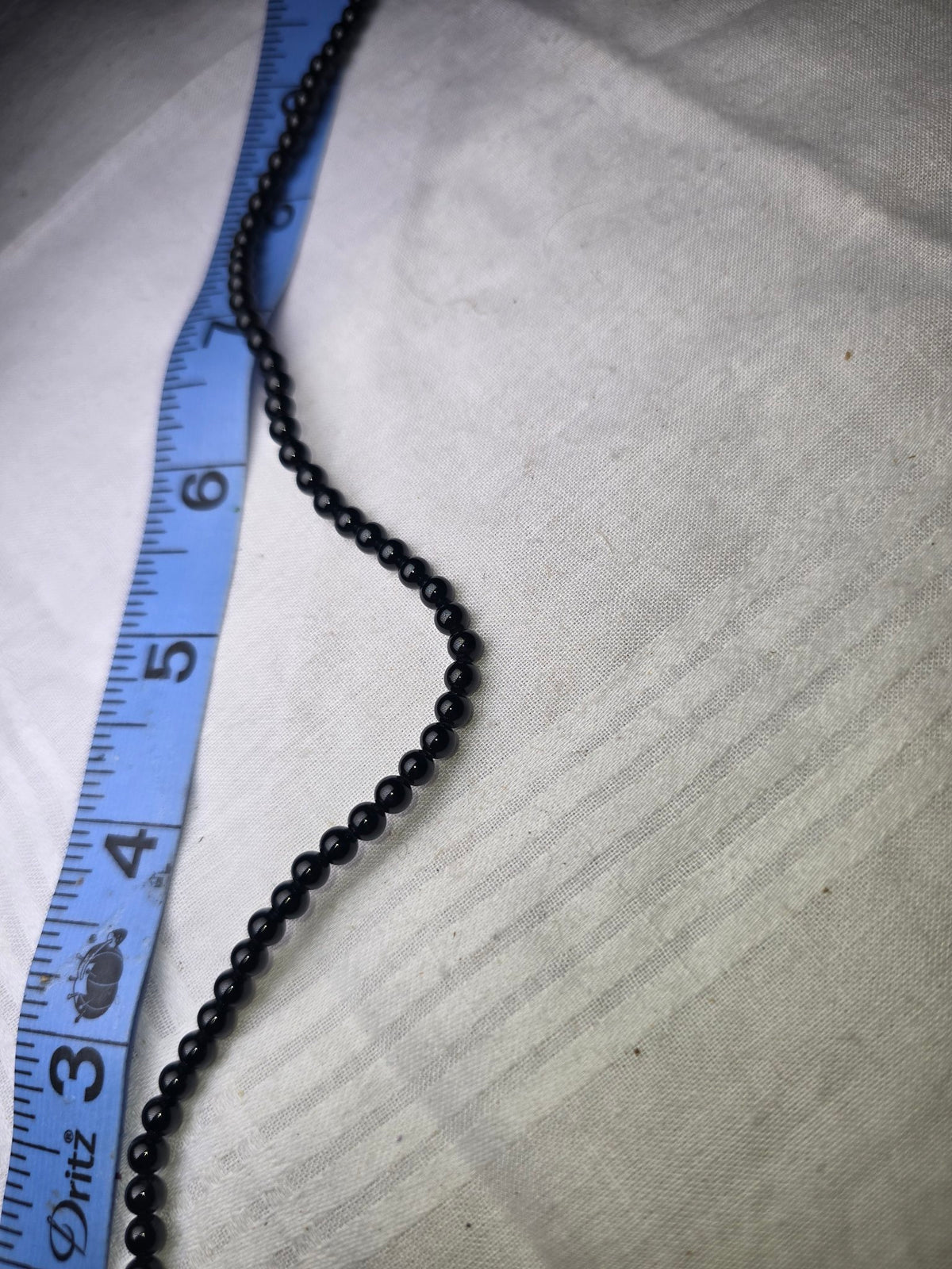 Black round bead strand closeup