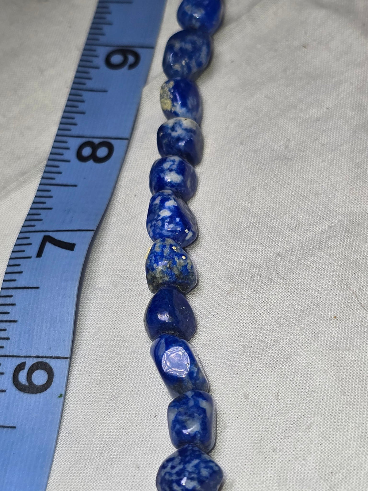 Lapis lazuli nugget bead strand closeup