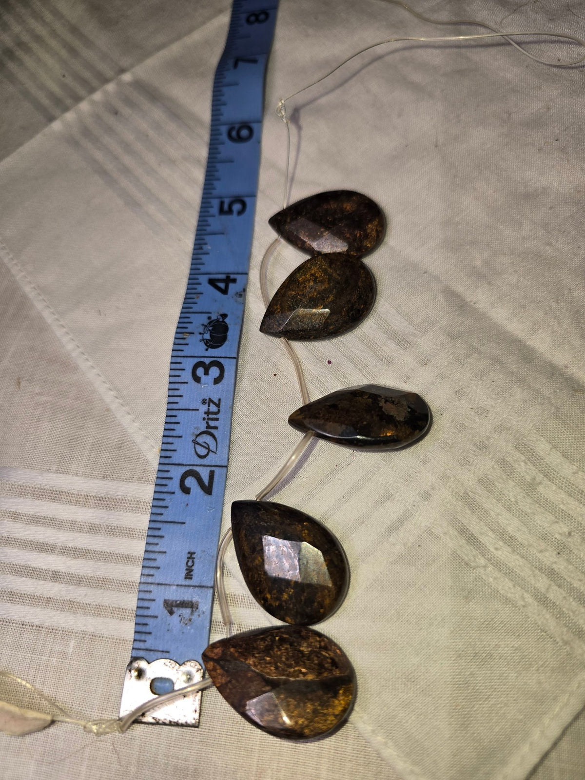 Bronzite faceted teardrop bead strand