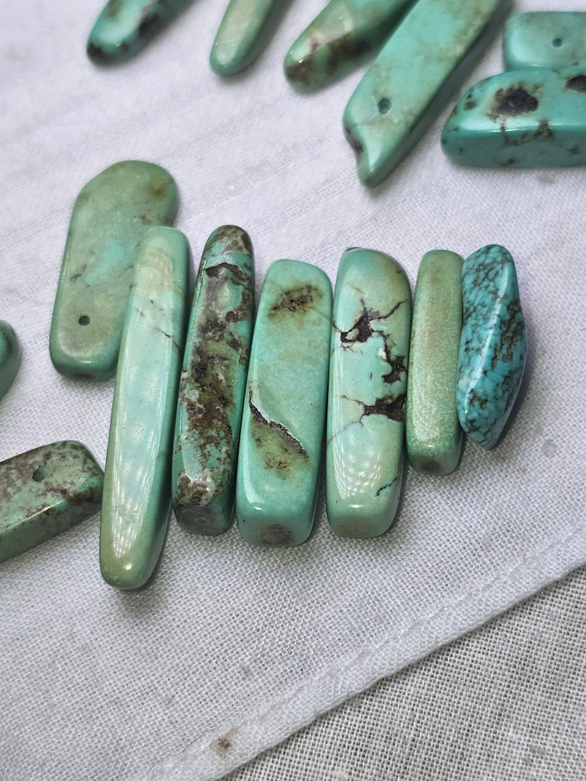 Turquoise stick bead lot closeup