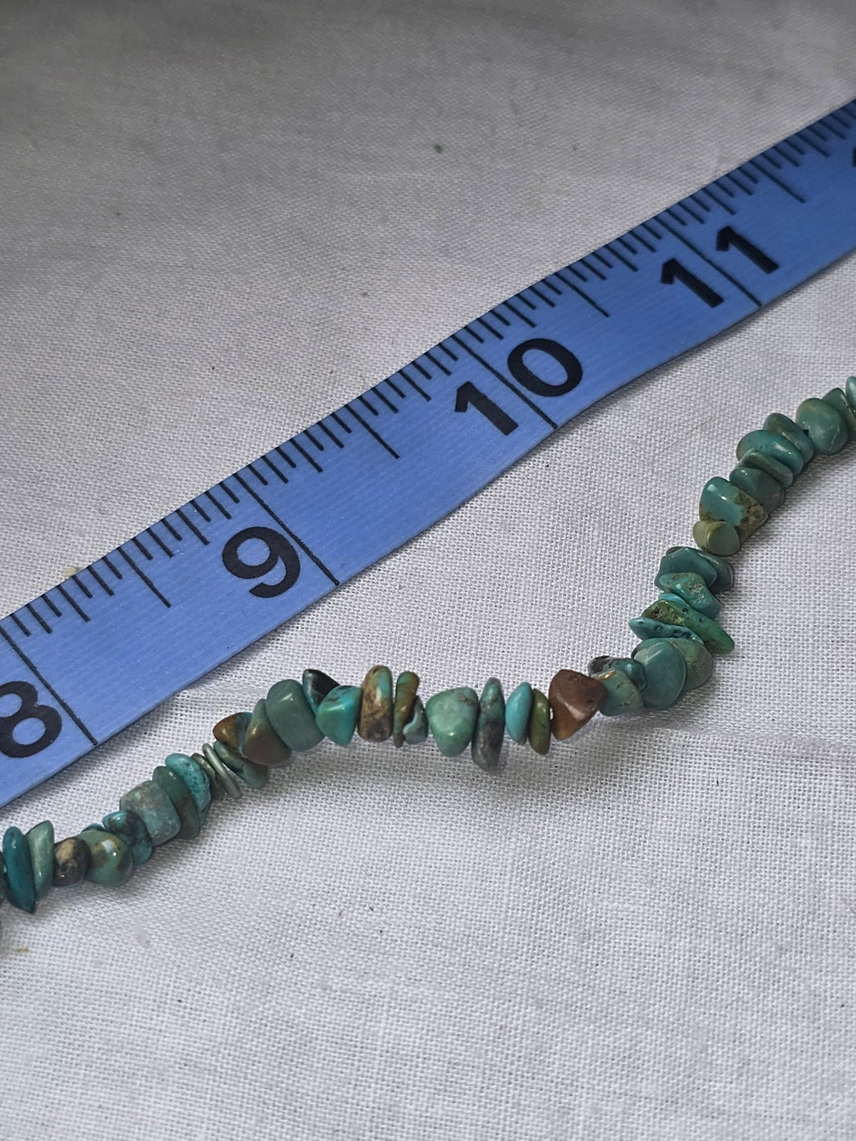 Turquoise chip bead strand closeup