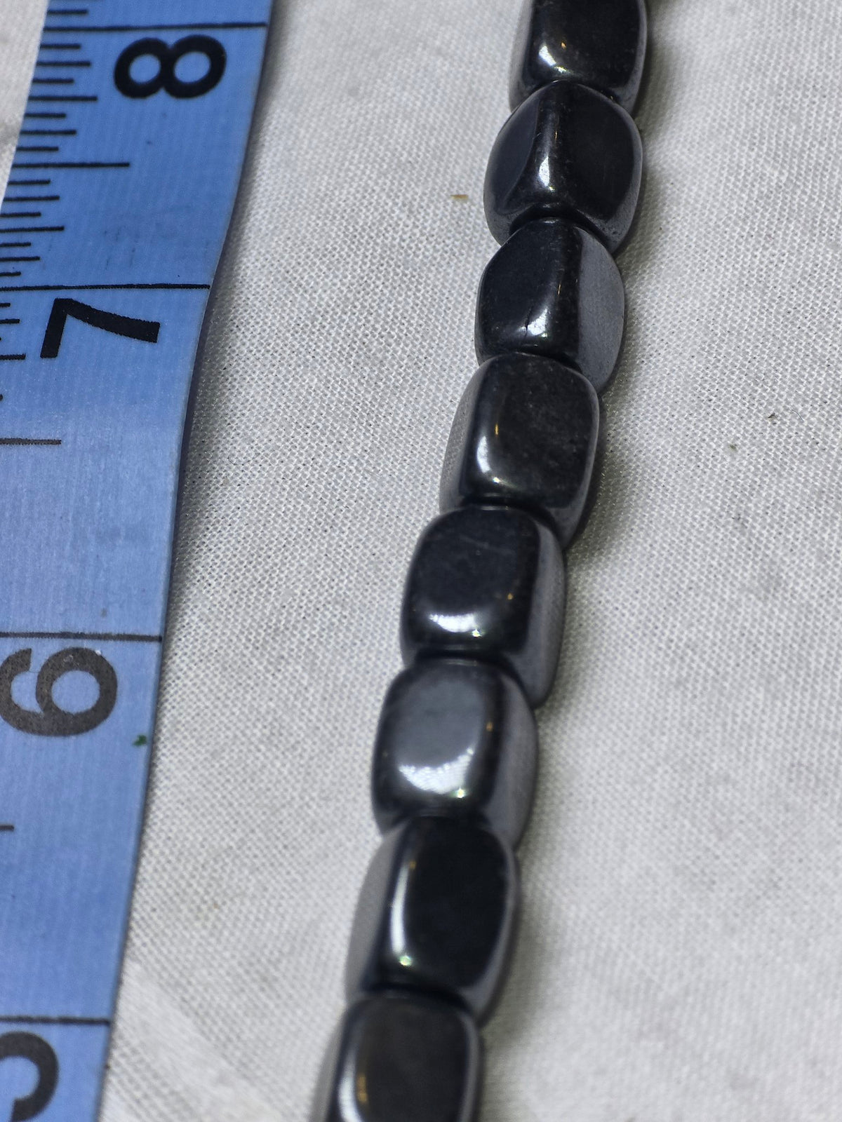 Black hematite rectangle bead strand closeup
