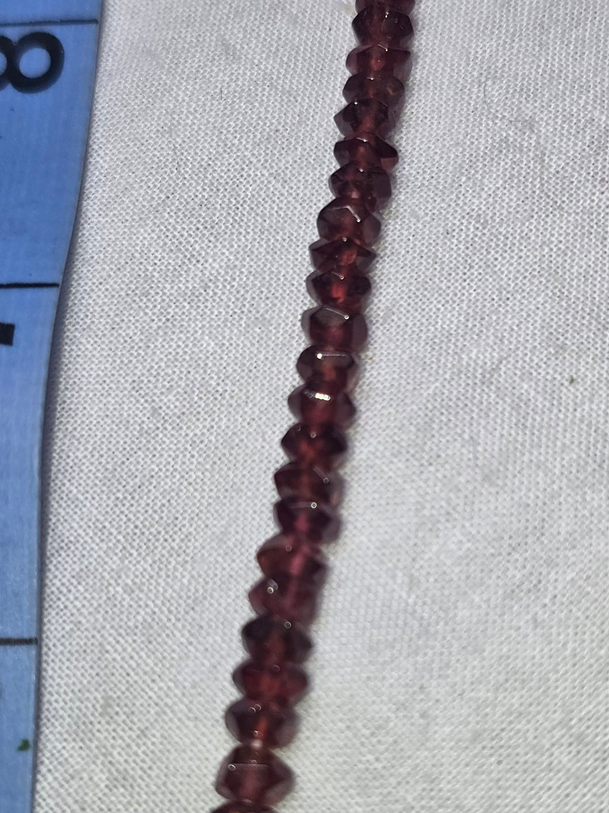 Garnet faceted rondelle bead strand closeup