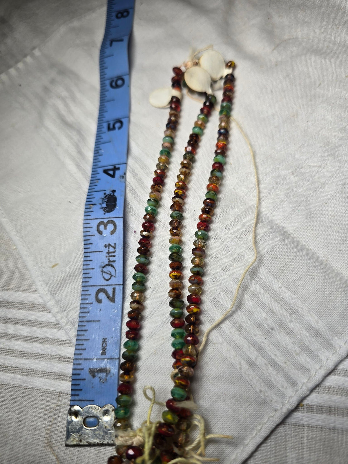 Multicolor faceted rondelle bead strand