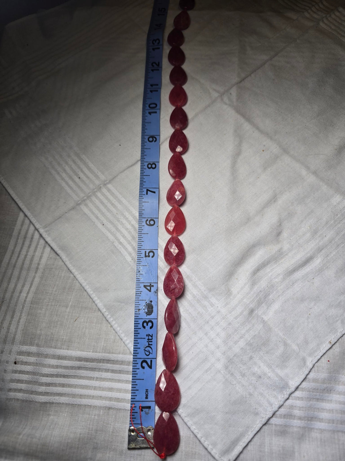Red pink faceted teardrop bead strand